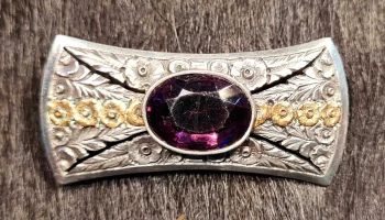 Antiguo prendedor criollo en plata y oro