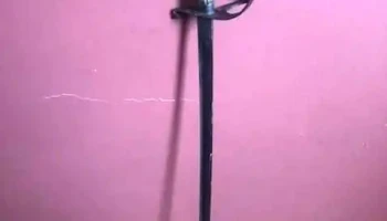 Antiguo sable de metal