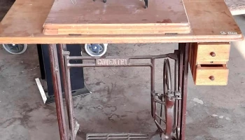 r maquina de cocer con pie de hierro