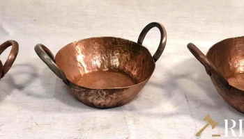 Tres cazuelas de cobre